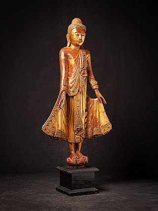 Antique wooden standing Mandalay Buddha