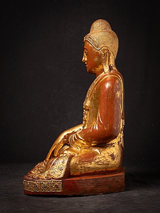 Beautiful antique wooden seated Mandalay Buddha statue