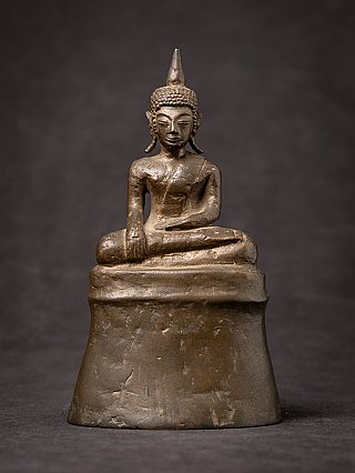 Antique Lao bronze Buddha statue seated in bhumisparsha mudra, full front view