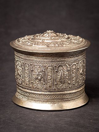 Antique Burmese silver box with lid, full view showing the embossed side panels