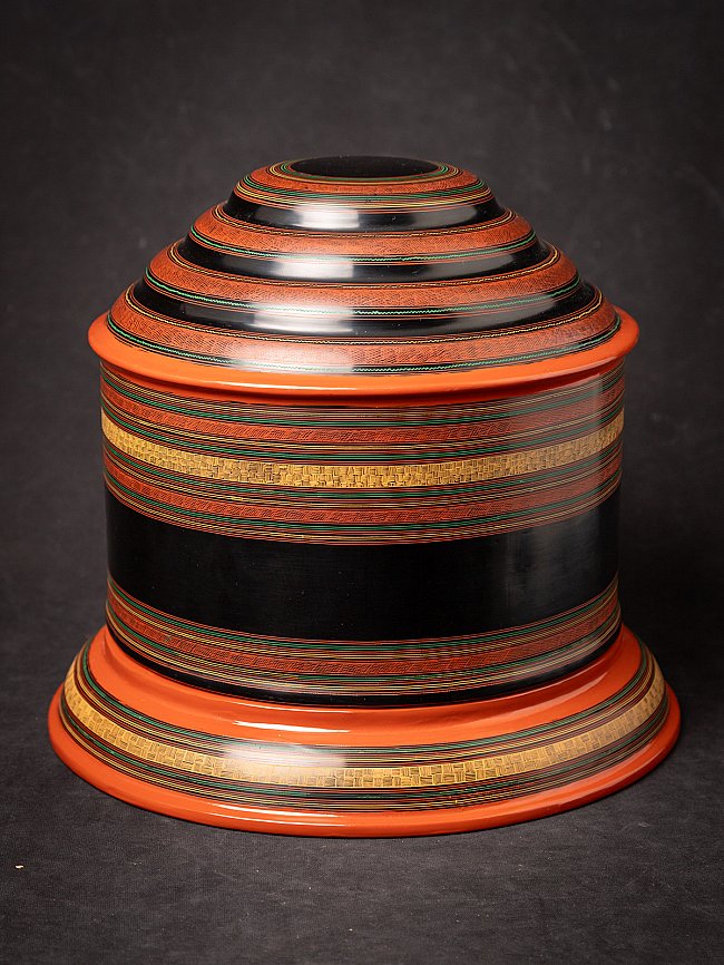 Burmese lacquerware betel box, black with red-orange bands, closed with lid
