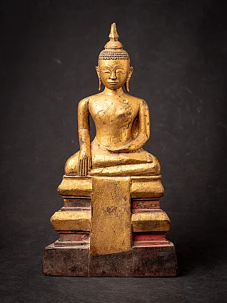 Antique wooden Cambodian Buddha statue