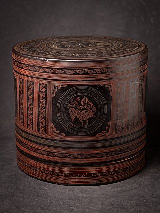 Burmese lacquerware betelnut box closed, cylindrical form with red incised bands and roundel motif