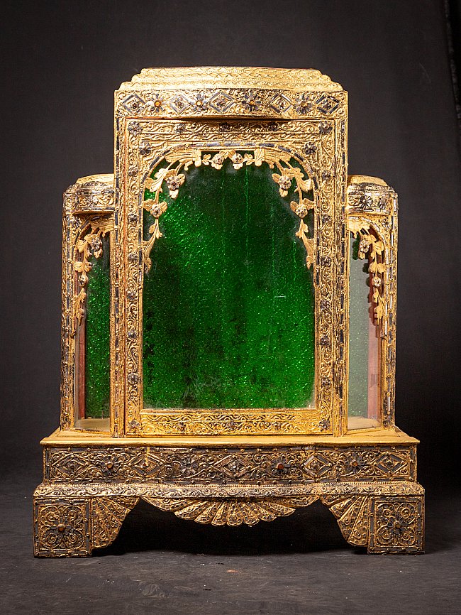 Large antique wooden Burmese temple shrine with green glass panels, full front view