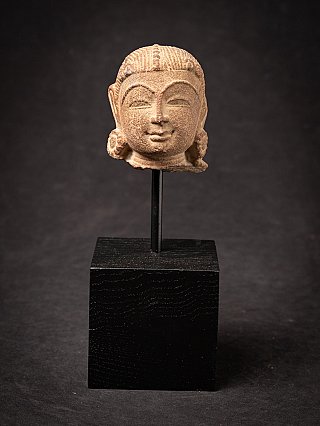 Indian apsara head on black stand, full front view