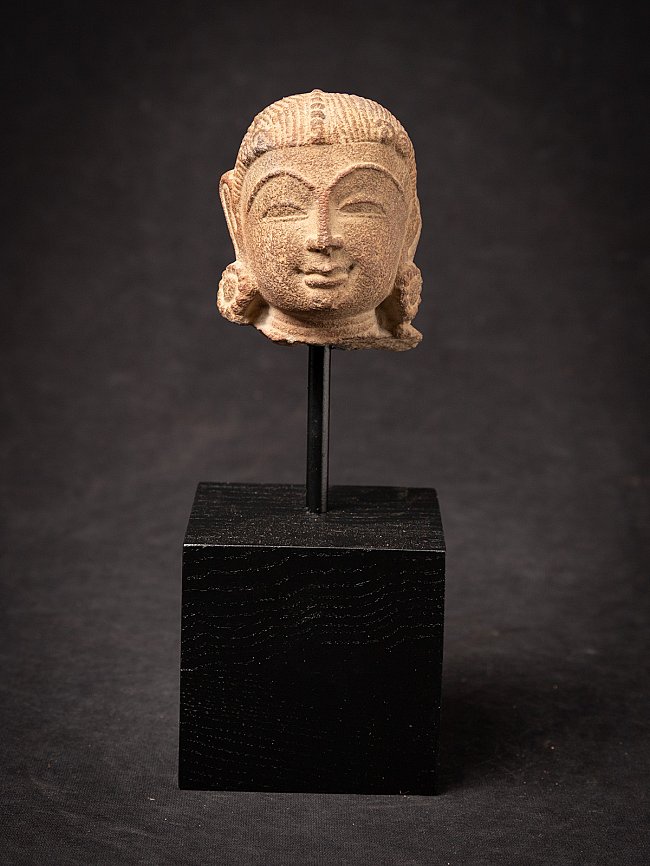 Indian apsara head on black stand, full front view