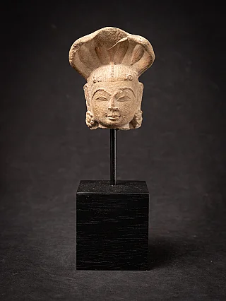 Antique sandstone head of a Nagini statue