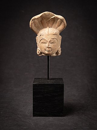 Head of an Indian Nagini statue on a stand, full front view with cobra hood