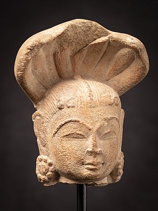 Antique sandstone head of a Nagini statue