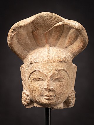 Antique sandstone head of a Nagini statue