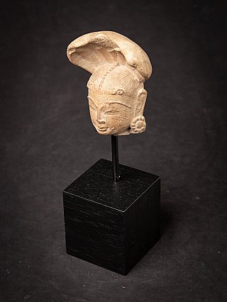 Antique sandstone head of a Nagini statue