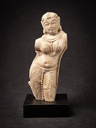 Old sandstone Apsara statue