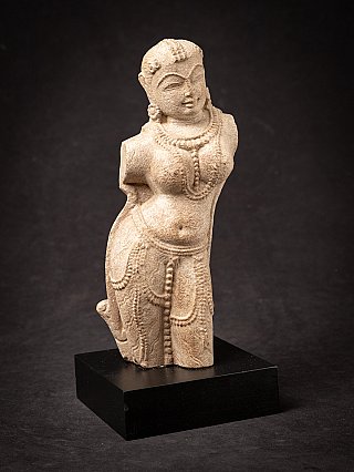 Old sandstone Apsara statue