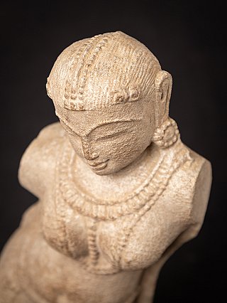 Old sandstone Apsara statue