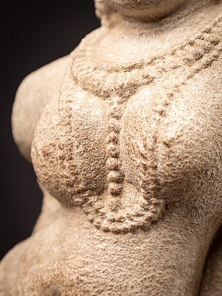 Old sandstone Apsara statue