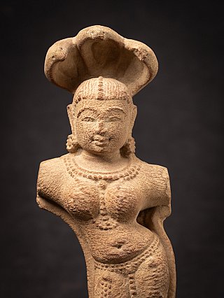 Old sandstone Indian Nagini statue