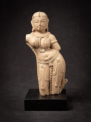 Old sandstone Apsara statue