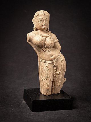 Old sandstone Apsara statue