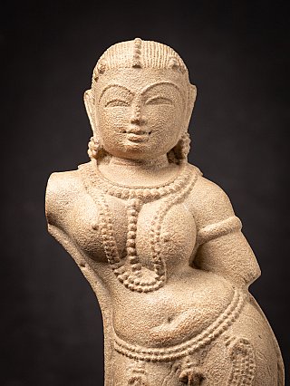 Old sandstone Apsara statue