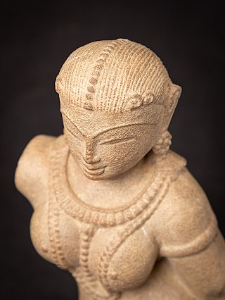 Old sandstone Apsara statue