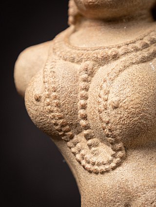 Old sandstone Apsara statue