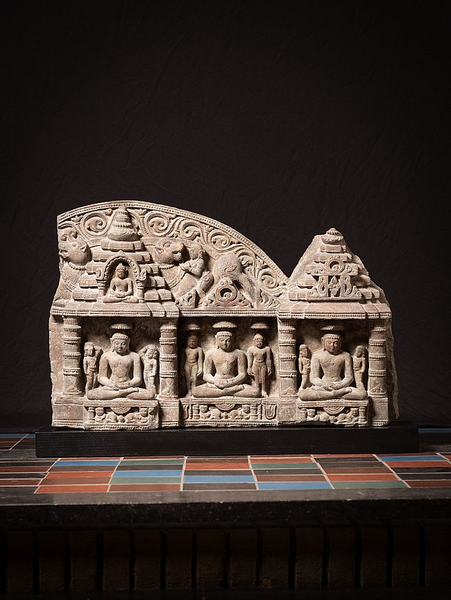 Antique Indian Jain stone panel with three seated figures in niches, full front view