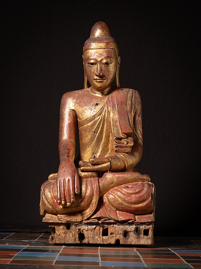Burmese Mandalay Buddha statue in wood, seated in bhumisparsha mudra, full front view
