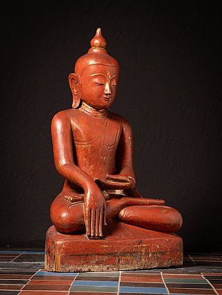 Large wooden Ava Buddha statue from Burma (Myanmar) in bhumisparsha mudra, three-quarter view