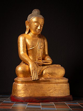 Buddha statue in Burmese lacquerware, three-quarter view with hands and base visible