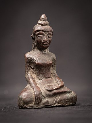 Cambodian bronze Buddha statue, seated, three-quarter right view
