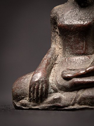 Detail of the earth-touching hand (bhumisparsha) on the Cambodian bronze Buddha statue