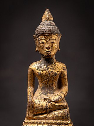 Antique wooden Thai Buddha statue