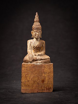 Seated Thai wooden Buddha statue in bhumisparsha mudra with traces of gilding, full front