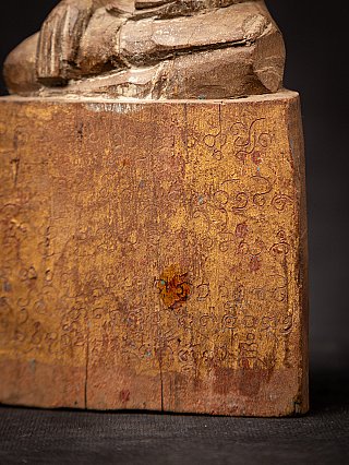 Base detail with incised script and worn edge