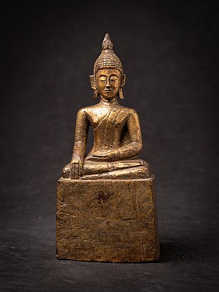 Antique Thai wooden Buddha statue seated in bhumisparsha mudra, full front view