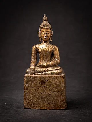 Antique Thai wooden Buddha statue seated in bhumisparsha mudra, full front view