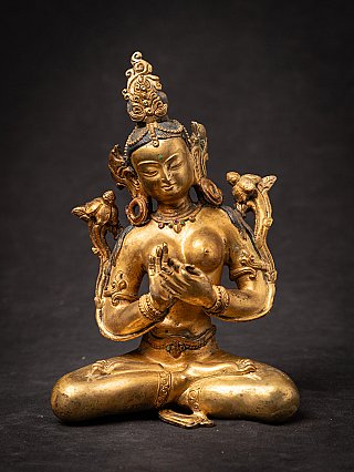 Green Tara Buddha statue in bronze from Nepal, seated with dharmachakra mudra, front view
