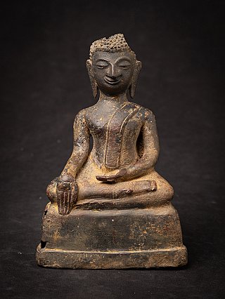 Thai bronze Buddha statue seated in bhumisparsha mudra on a stepped base, full front
