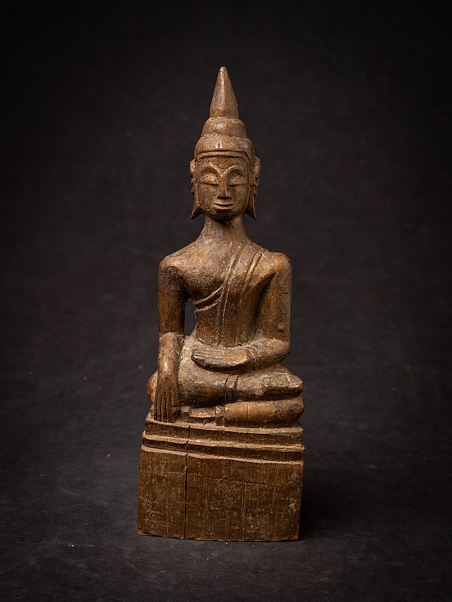 Thai wooden Buddha statue seated in bhumisparsha mudra, full front view