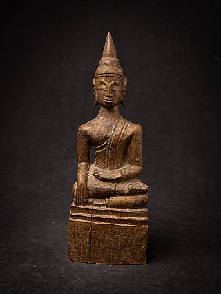 Thai wooden Buddha statue seated in bhumisparsha mudra, full front view
