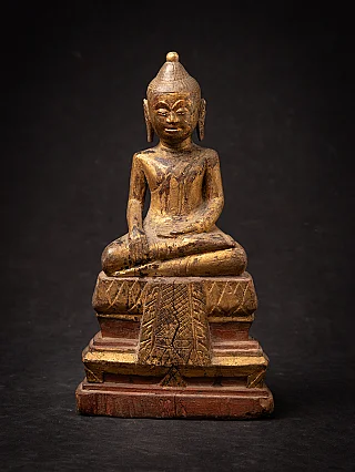 Antique wooden Thai Buddha statue