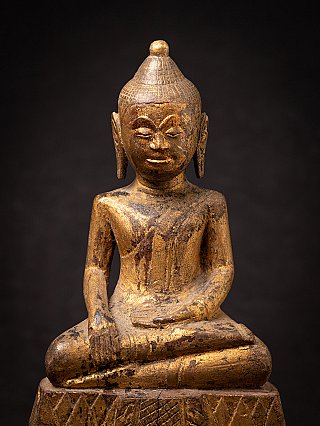Antique wooden Thai Buddha statue