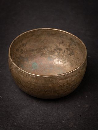 Nepali bronze singing bowl showing the interior surface and patina