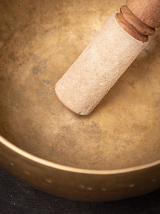 Leather-covered end of the striker inside the Nepali bronze singing bowl, detail