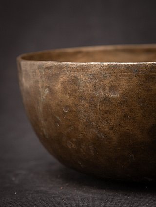 Side and rim close-up of the antique Nepali bronze singing bowl