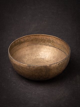 Nepali bronze singing bowl without mallet, angled view showing the interior