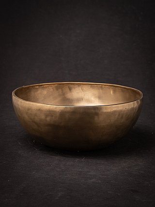 Nepali bronze singing bowl shown in full view with open rim
