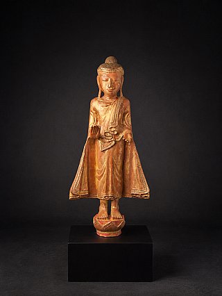 Mandalay Buddha statue from Burma (Myanmar) in wood, full front view on black plinth
