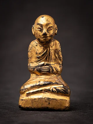 Antique wooden Burmese monk statue seated with hands in dhyana mudra, full front view