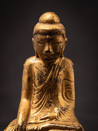 Front face detail of the Burmese Shan wooden Buddha statue